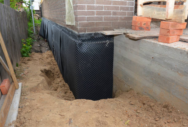 Happy homeowners after waterproofing job in Lafayette